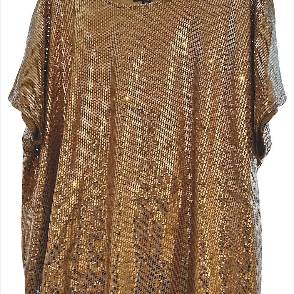 Roman’s champagne colored sequins top.